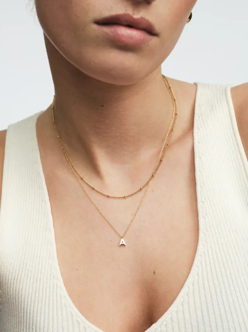 Halsband Mockberg Petite Plain Bokstav Guld